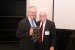 Dr. Nagib Callaos, General Chair, giving Prof. Dr. Dr. Ulrich Sprick a plaque "In Appreciation for Delivering a Great Keynote Address at a Plenary Session."